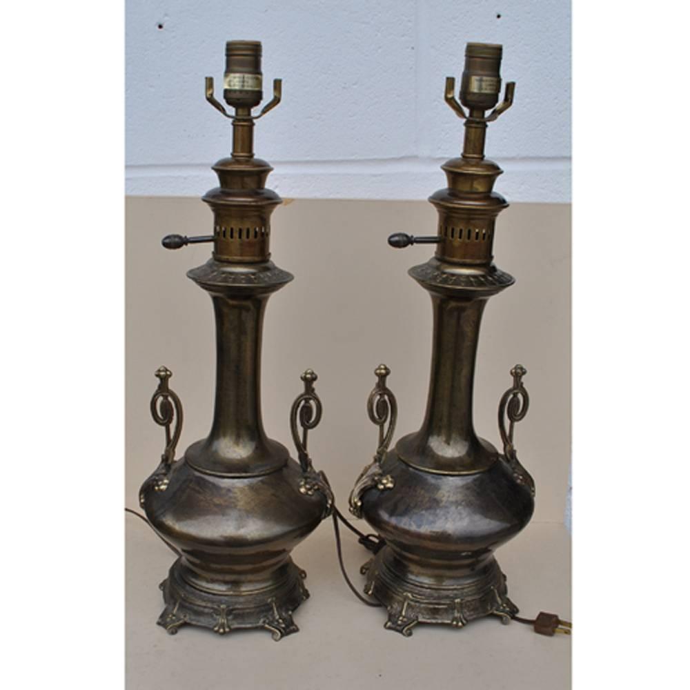 Vintage Pair of Aged Brass Lamps by Frederick Cooper: Description: A vintage pair of aged brass lamps by Frederick Cooper A pair of urn style table lamps with intricate details and a beautiful patina on the brass. Details Creator Frederick Cooper (Design