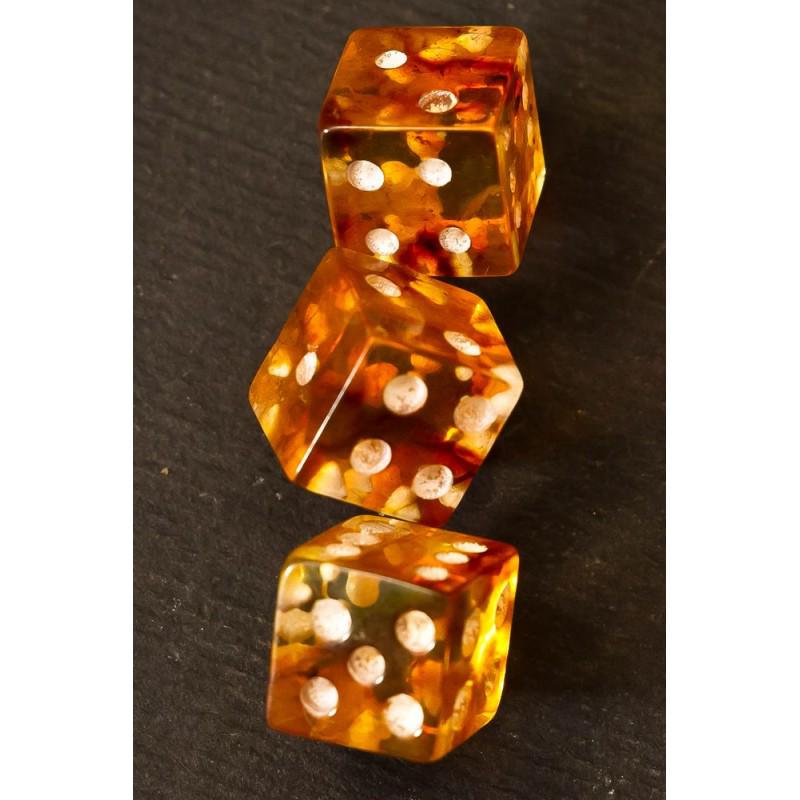 3 Dice (figurine) 100% natural Baltic amber stone raw: 3.02 g. Dice (figurine) 100% natural Baltic amber. There are 3 dice in the setWeight: 3.02 gramSize: 10x10 mmStone: 100% natural Baltic amberTreatment: noCondition: as on the photo (good)Tested 100% n