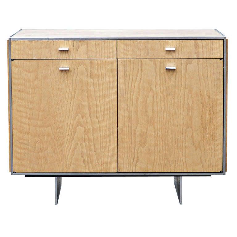Davis Allen For GF Oak Credenza with Stainless legs and: Title: Davis Allen For GF Oak Credenza with Stainless legs and Trim Description: A small vintage oak credenza designed by Davis Allen and from the Davis Allen Collection for GF. Drawers include three