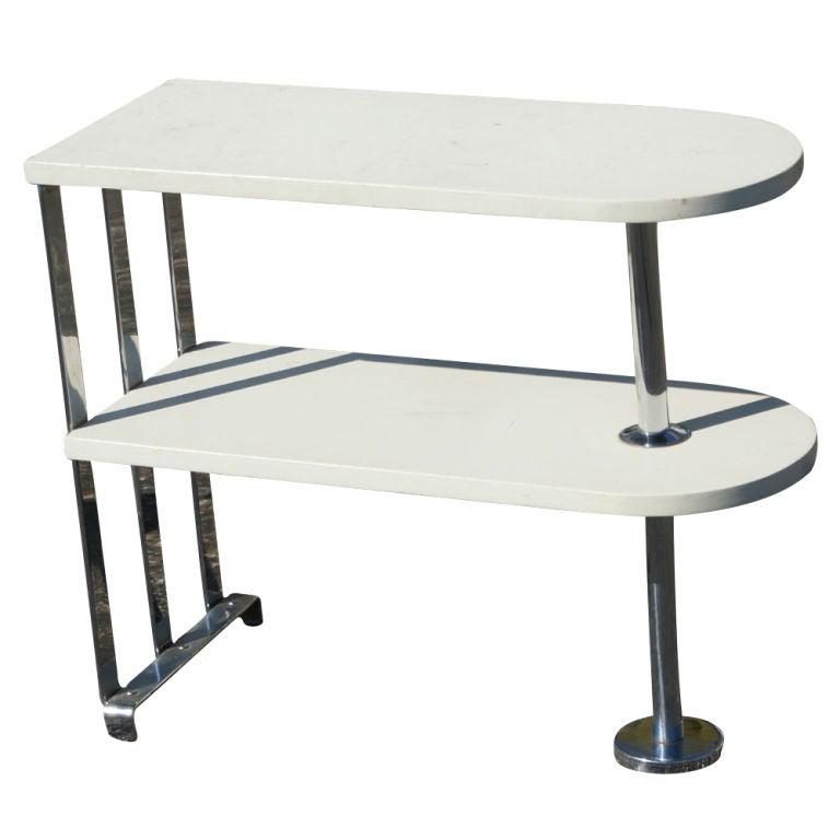 Alfons Bach For Lloyd Loom Art Deco Side Table Shelf: Title: Alfons Bach For Lloyd Loom Art Deco Side Table Shelf Description: An Art Deco two-tier side table or shelf unit designed by Alfons Bach and made by Lloyd Loom. Chrome frame with white wooden sh