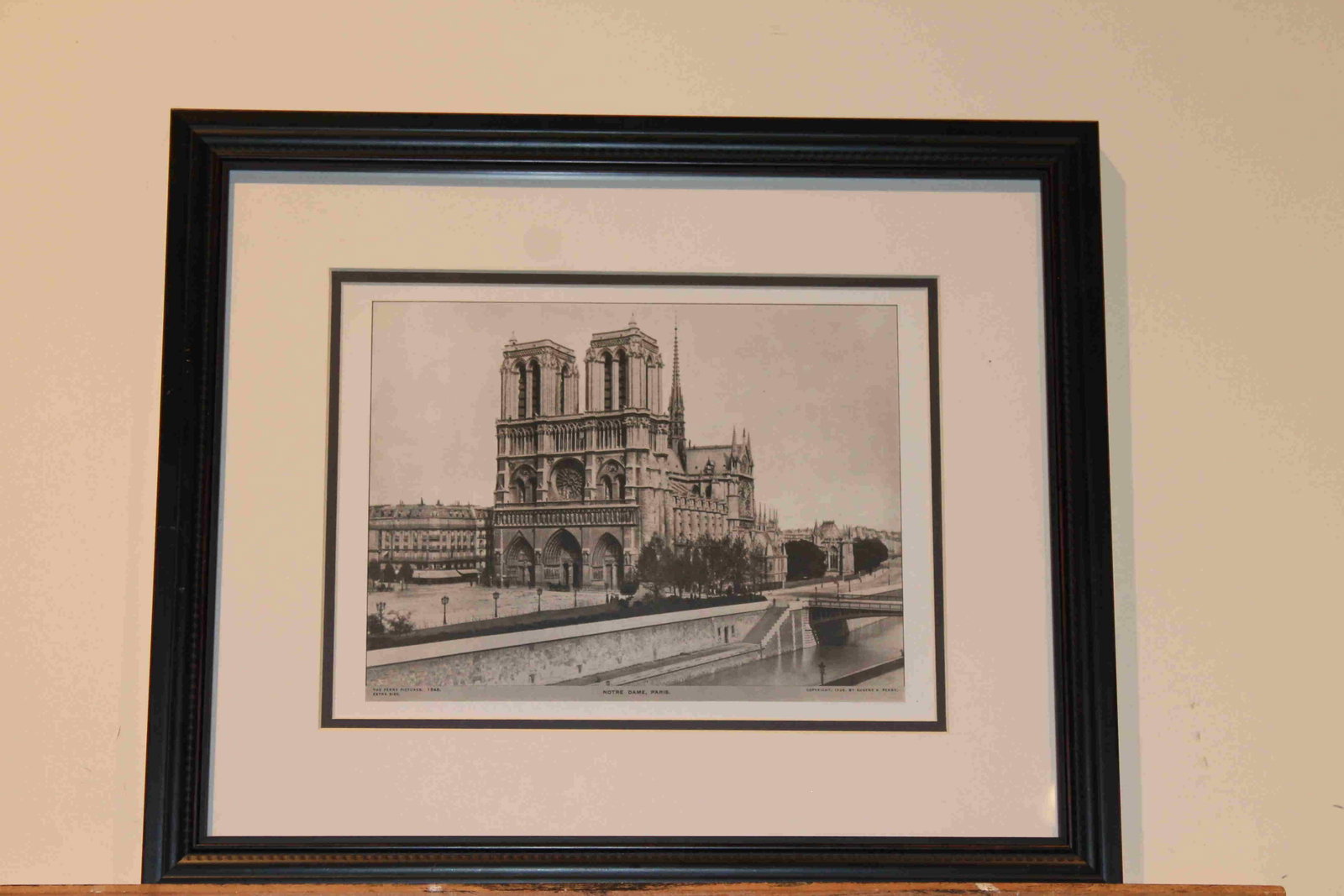 1928 Notre Dame Paris: Title: 1928 Notre Dame Paris Author: Perry Medium: Ink on Paper/Glass/Wood Dimension: 19"X16" Description: Print of Notre Dame Cathedral in Paris dated 1928. Printed and published by Eugene Perry in N