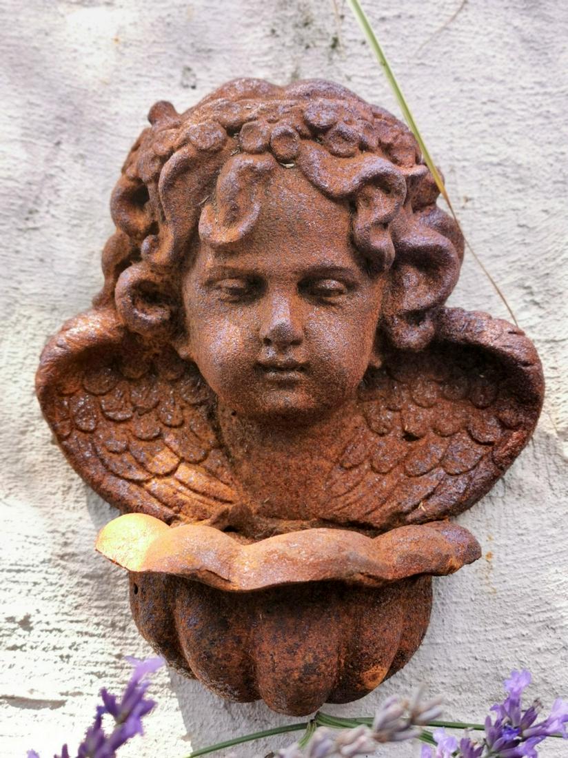 Lovely cast iron wall ornament - cherub font: Title: Lovely cast iron wall ornament - cherub font Maker: Unknown Origin: United kingdom Date.Period: 20th century Material: Cast iron Size: Height: 30 cm / 12 inchCast iron Description: A very nice 