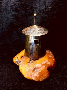 Light house statue on an Amber piece: Title: Light house statue on an Amber pieceMaker: UnknownOrigin: UnknownDate/Period: UnknownMaterials:AmberSize:Size: 78.00 x 74.20 x 20.79 mm Size: 3.071 x 2.921 x 0.819 inches Description:Light