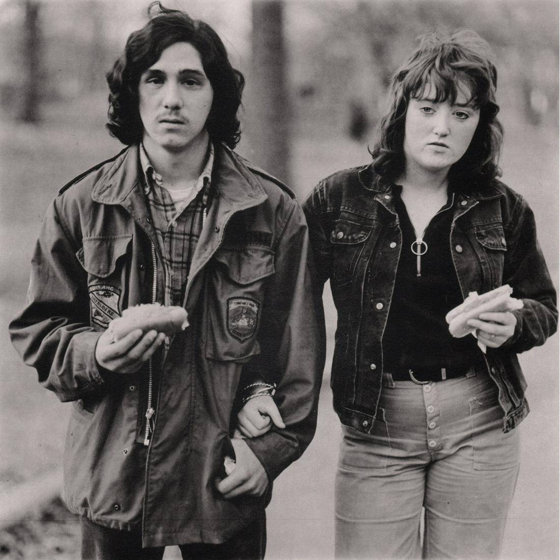 DIANE ARBUS - A Young Man & his Girlfriend, 1971: Artist: DIANE ARBUS Print Title:A Young Man & his Girlfriend with hot dogs in the park, New York, 1971 Limited Edition folio 653/1000 Medium: Sheet-Fed Gravure Printed in 1979 Printed in Italy Image S