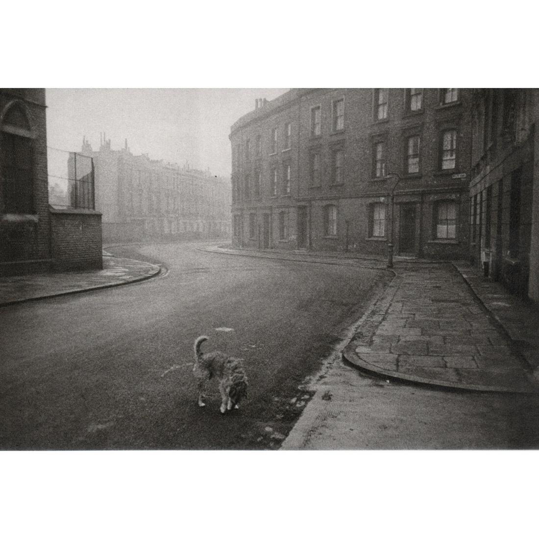 ROBERT FRANK - Dog on an Empty Street in Great Britain,: Artist: ROBERT FRANK Print Title: Dog on an Empty Street in Great Britain, 1951 Medium: Sheet-fed Gravure Printing Date: 1970's Printed in England Image Size: 4.75 x 7 inches Robert Frank (1924-2019)