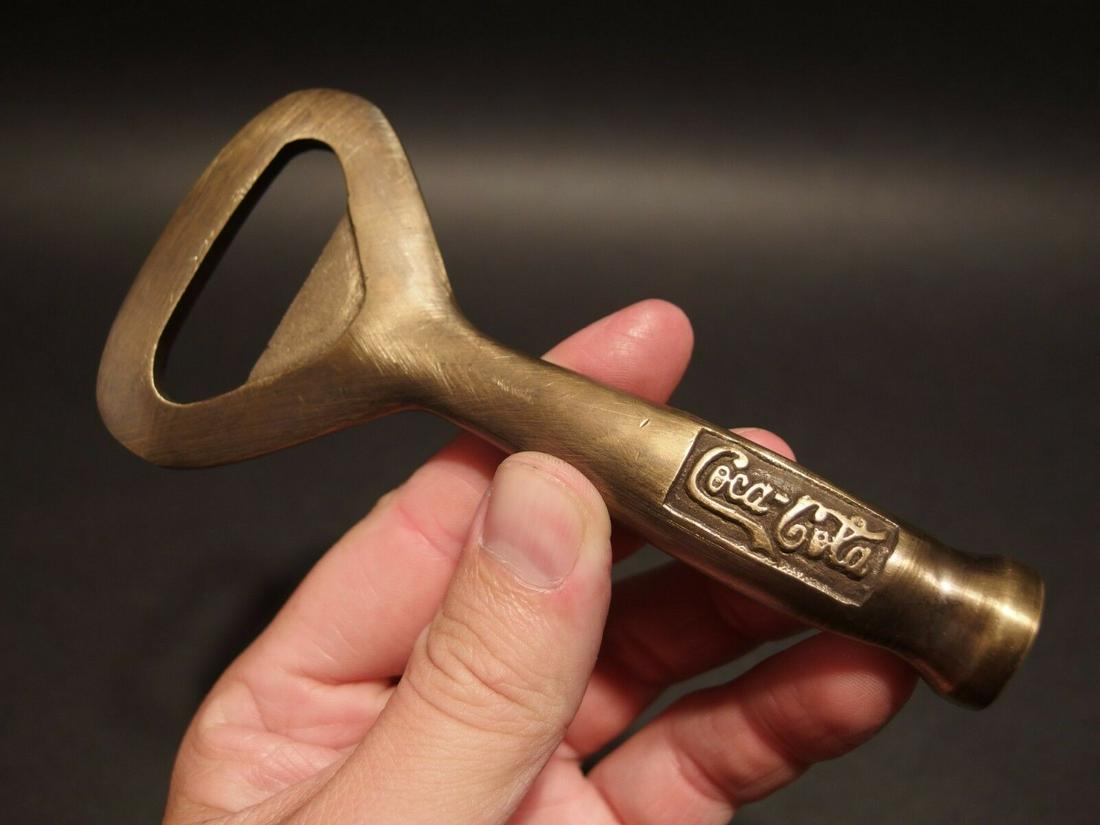 Brass Coca Cola Soda Beer Bottle Cap Opener: 5 1/8" Long x 2 1/2" Wide Great reproduction heavy solid brass bottle opener. This piece was made to look just like an antique, but is actually new. Nicely made all solid brass... Great for use or dis