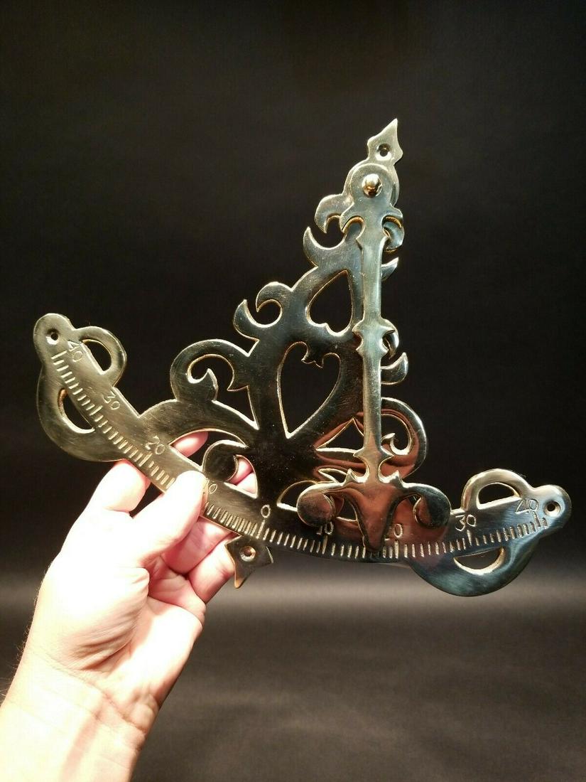 Brass Pendulum Nautical Inclinometer: 10 3/8" High x 12" wide Such a neat reproduction antique instrument! This is the brass pendulum inclinometer. This works using a pendulum to gauge the pitch on a boat. Such a neat functional instrumen