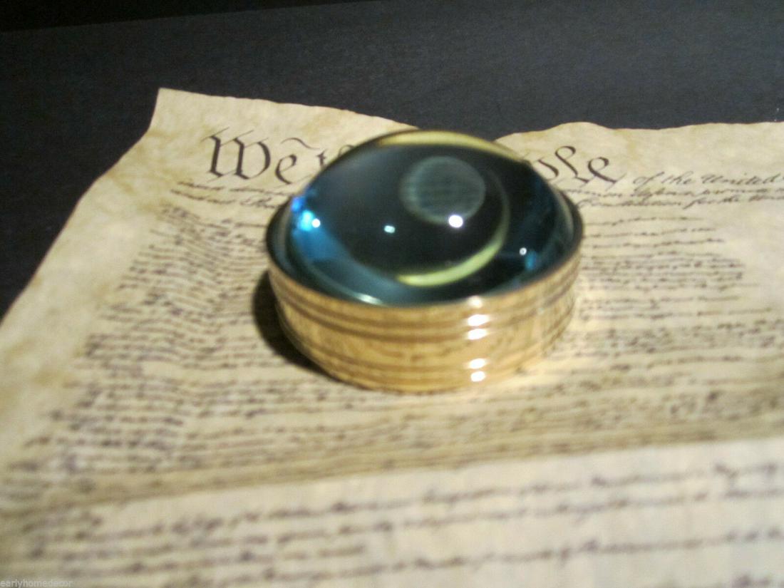 Small Round Brass Heavy Magnifying Glass Desktop Lens: Vintage Antique Style Solid Brass Heavy Glass Magnifying Desktop Lens Description 2" 1/8" Wide x 1 1/8" High Nice reproduction of an antique magnifying lens. Nice heavy quality thick glass. This piece