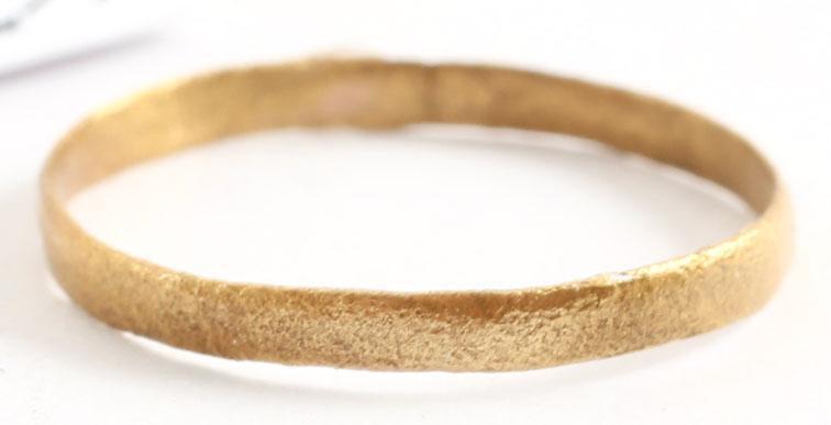 VIKING WEDDING RING, 866-1067 AD: SIZE 7 ½. Gilt bronze, size 7 1/2 , 2.0mm width, slightly rounded section. Professionally refurbished with the surface restored in 24 karat gold. Gift boxed with certificate of authenticity. Reserve: