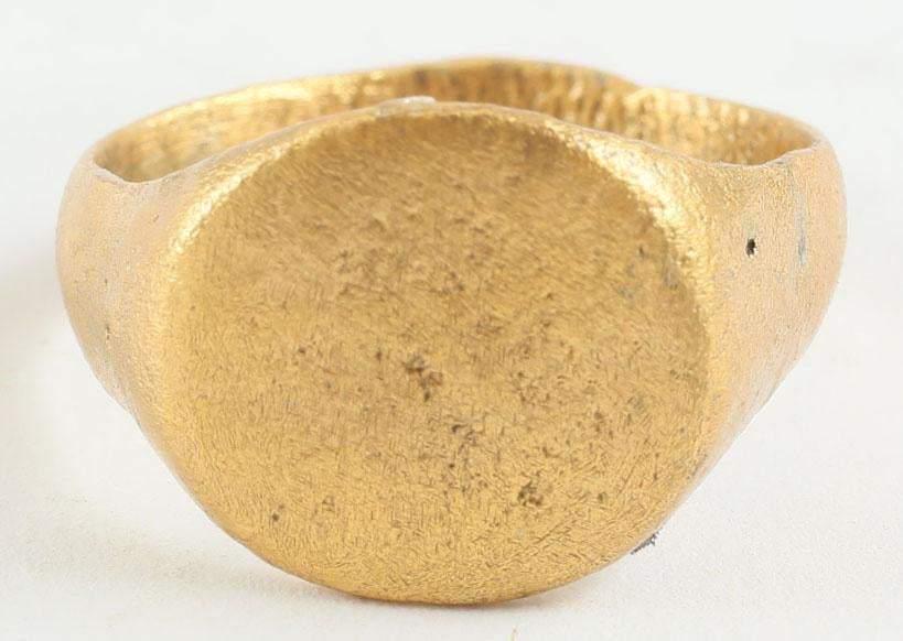 VIKING WARRIOR’S RING, 9th-10th CENTURY AD, SIZE 9 ¾: Size 9 3/4 with broad oval face raised from the shoulders. Broad rounded band flaring to the shoulders. Surface textured from. Professionally refurbished with the gold overlay restored. Gift boxed wit