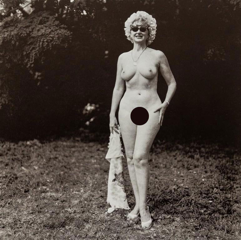Diane Arbus- Nudist with Swan Sunglasses, PA, 1965 (1 of 2)