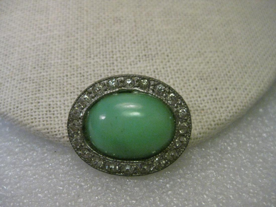 Vintage Art Deco Brooch, Early 1900's, Silver Tone Mint: Vintage art deco brooch, silver tone oval, mint green faux moonstone, 1920-1930's. Clear Rhinestones in frame. Oval slight over 1" in one direction and slightly under 1" the other. Domed stone - looks