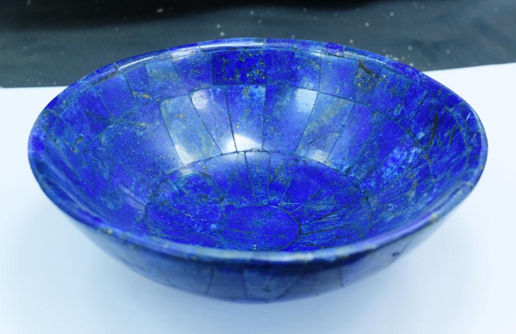 Hand crafted, stunning Royal Blue Color Oval Shape: Materials handcrafted bowl, jade more Description This stunning Lapis Lazuli Gemstone Bowl has an attractive royal blue color with inclusions of golden pyrite. It is a very striking piece and the idea