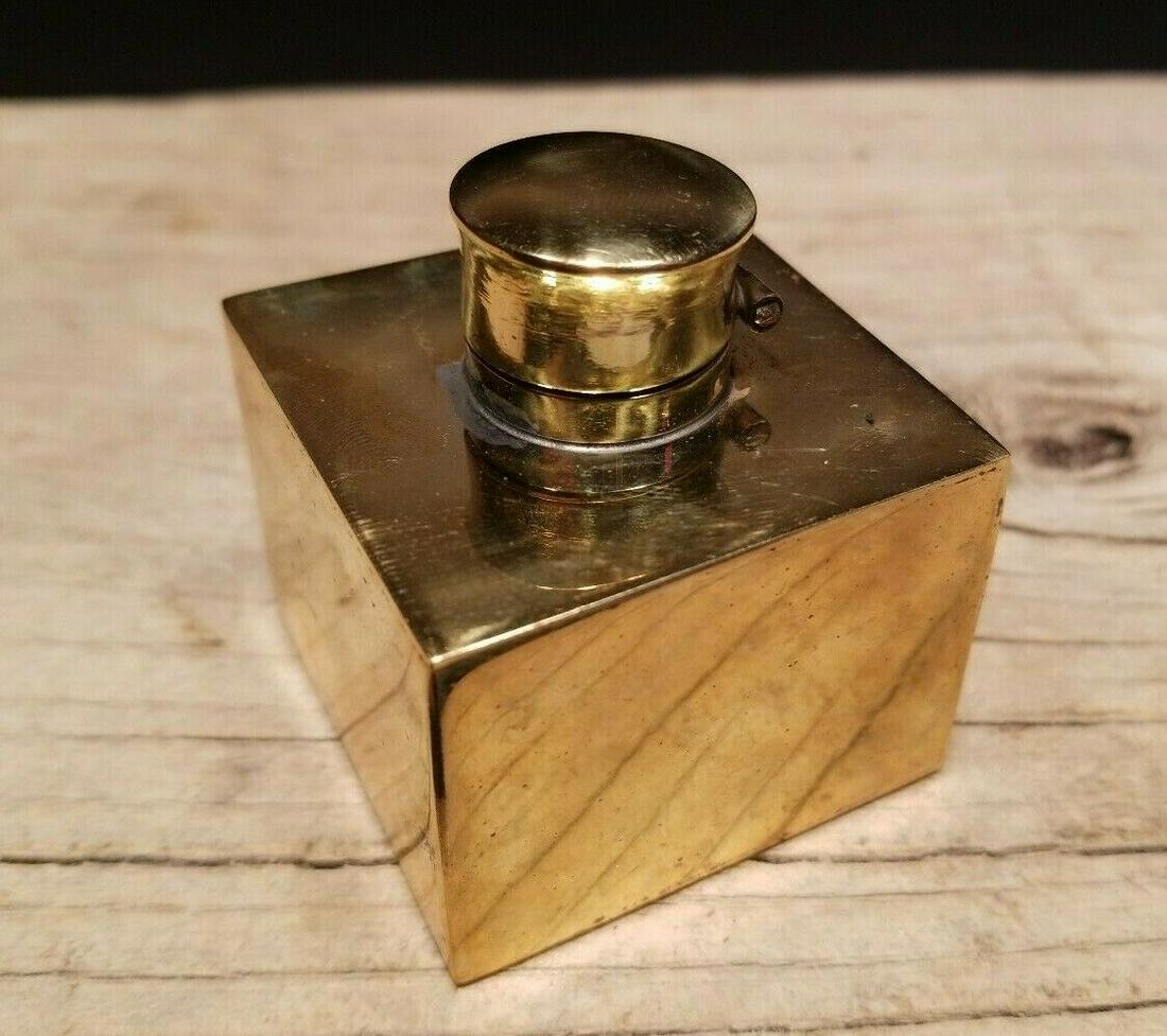 Brass Inkwell Ink pot Bottle: Charming 2" High x 1 7/8" x 1 7/8 wide Reproduction antique brass inkwell. Charming inkwell with subtle signs of being handmade. Notice the brass lid is hinged. This piece is in new condition never us