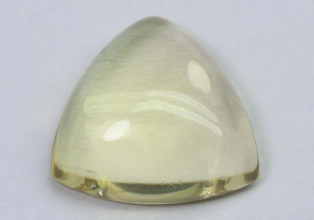 7.63 Cts Natural Lemon Quartz: No Reserve! Title: 7.63 Cts Natural Lemon Quartz Additional Info: Gemstone : Natural Lemon QuartzWeight : 7.63 CtsShape : Triangular CabuchonColour : Greenish Yellow Dimensions : 14.6x14.5x5.6 mmOrigi