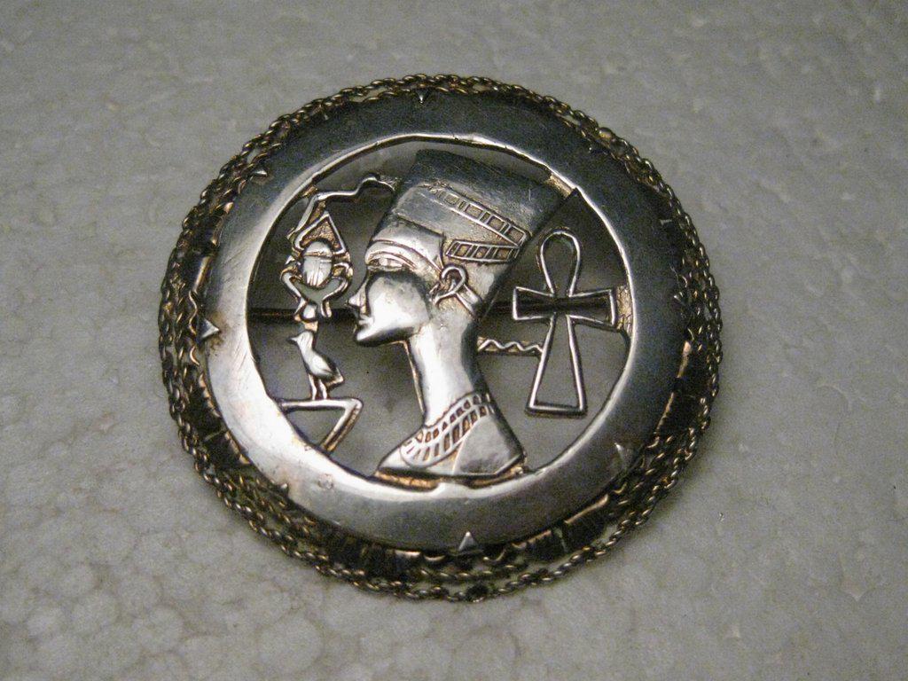 Vitorian Egyptian Revival Brooch Queen Nefertiti,: Victorian Sterling Silver Egyptian Brooch with gold wash (or gold?) wash. It has a cut-out center featuring a beetle, a Large Queen Nefertiti and Ankh cut-out in the center with a silver frame around 