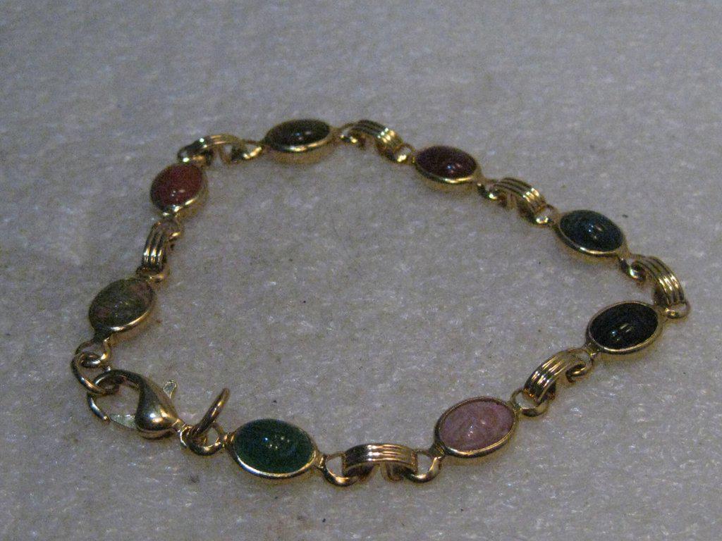 Vintage Egyptian Scarab Bracelet, 7", Carnelian,: Vintage Egyptian Scarab Bracelet, Gold Tone, 1980's, 1/3 wide, with 15mm long with eight oval bezel set stones that are appx. 8mm by 5.5mm. Stones are : tiger's eye, unakite, carnelian, jadeite, rose 