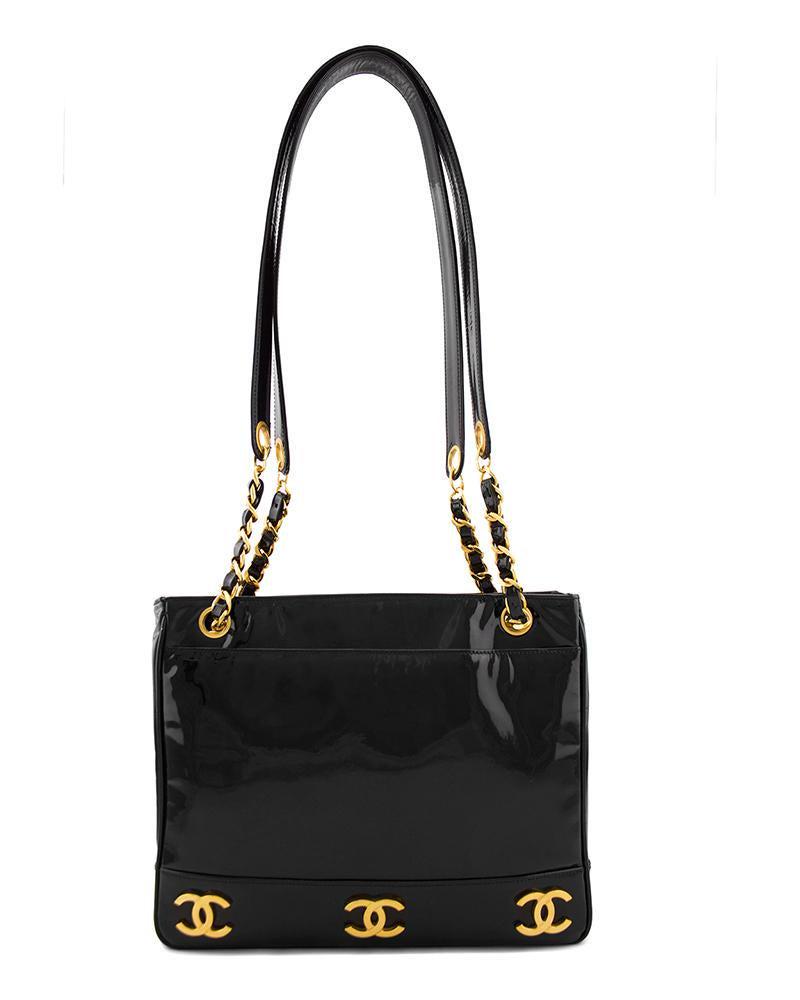 Chanel Black Patent Leather Double Shoulder Strap Bag: A bag that never goes out of style, Chanel black patent leather shoulder bag with double straps and exterior pockets. The solid patent leather shoulder straps have gold chain and leather sections at t