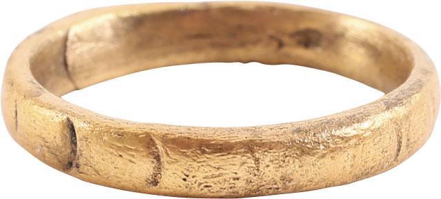 VIKING WOMAN’S WEDDING RING, S 4. 9th-11th CENTURY AD: Gilt bronze, size 4 for the small finger as was the custom. 2.6mm width band with shallow rounded face have cut with a series of ovals. Vikings exchanged rings on the pommel of the groom’s sword. Pr