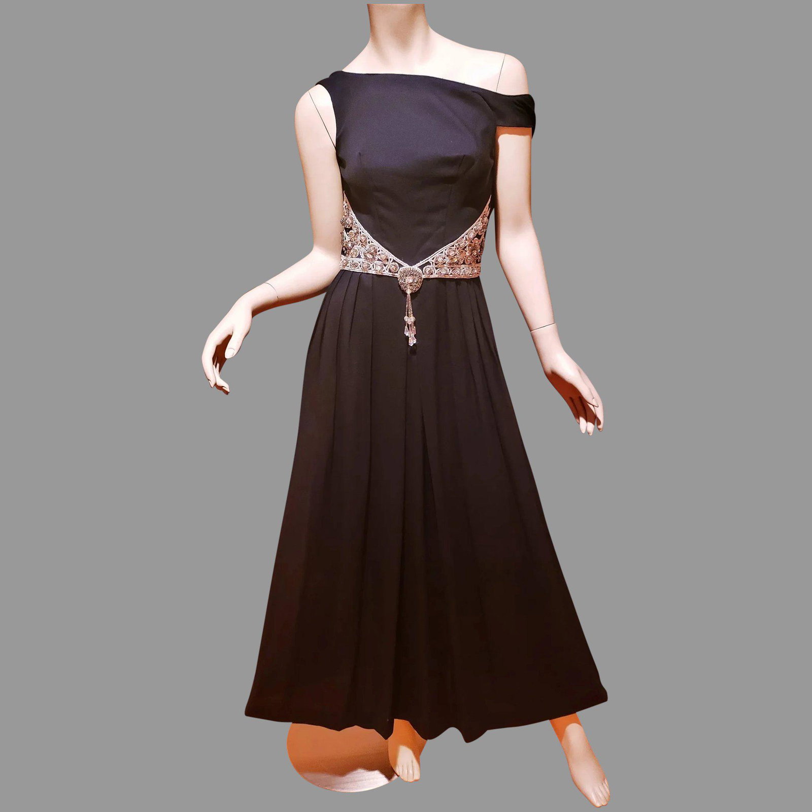 Original 1960's Elizabeth Arden Paris Evening maxi: A Stunning Original Elizabeth Arden paris. Black silk crepe. Skirt is pleated harem style with a wide all beaded ,Rhinestones, Sequins and Danglers in Silver. Something of real beauty to see in real L