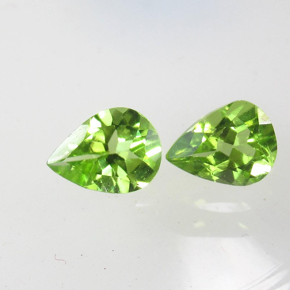 2.12 Ct Natural Pakistan Peridot Pear Pair: No Reserve! Title: 2.12 Ct Natural Pakistan Peridot Pear Pair Clarity: VVS Gemstone: Natural Peridot Carat Weight: 2.12 Size/Dimensions: 7.70 x 5.90 x 4.20 mm / 2 PC's Additional Information: Top Clas