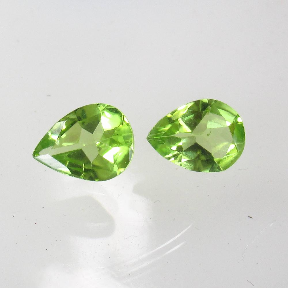 1.89 Ct Natural Pakistan Peridot Pear Pair: No Reserve! Title: 1.89 Ct Natural Pakistan Peridot Pear Pair Clarity: VVS Gemstone: Natural Peridot Carat Weight: 1.89 Size/Dimensions: 7.90 x 6.00 x 3.20 mm / 2 PC's Additional Information: Top Clas