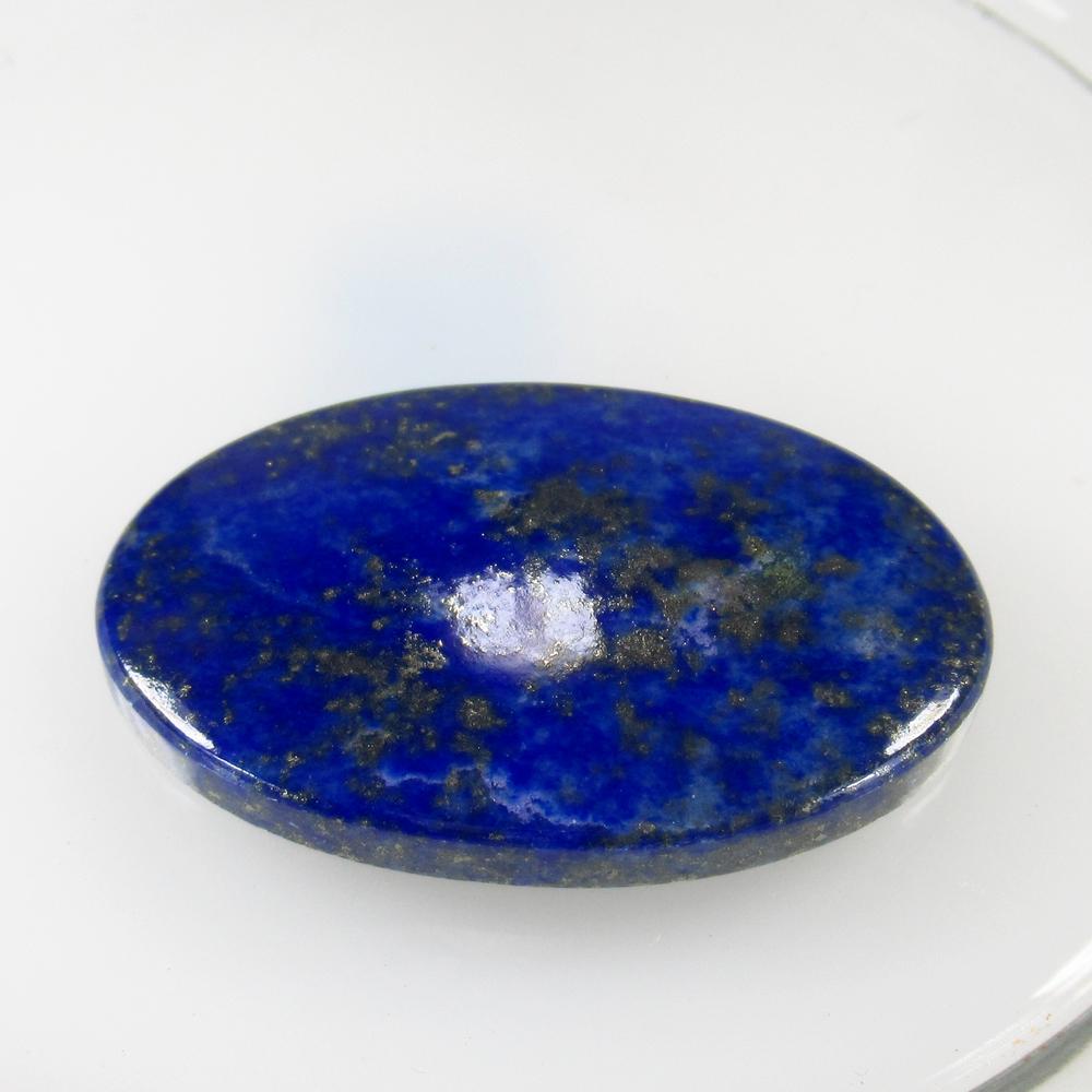 71.40 Ct Natural Lapis Lazuli 43x27 mm Oval Cab: No Reserve! Title: 71.40 Ct Natural Lapis Lazuli 43x27 mm Oval Cab Clarity: Opaque Gemstone: Natural Lapis Lazuli Carat Weight: 71.40 Size/Dimensions: 43.00 x 27.00 x 5.80 mm Additional Information: N