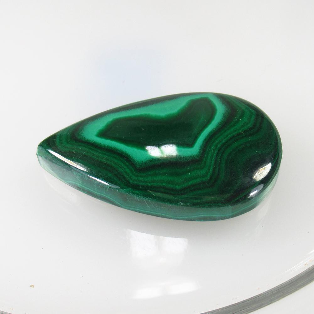 58.64 Ct Natural Green Malachite 36x22 mm Pear Cab: No Reserve! Title: 58.64 Ct Natural Green Malachite 36x22 mm Pear Cab Clarity: Opaque Gemstone: Natural Malachite Carat Weight: 58.64 Size/Dimensions: 36.00 x 22.00 x 6.40 mm Additional Information: N