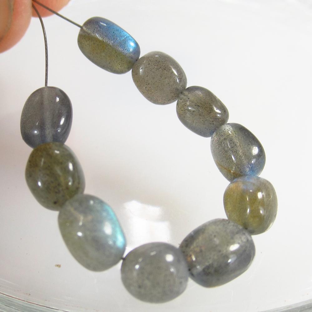 16.77 Ct Natural 10 Labradorite Drilled Dumble Beads: No Reserve! Title: 16.77 Ct Natural 10 Labradorite Drilled Dumble Beads Clarity: Transparent Gemstone: Natural Labradorite Beads Carat Weight: 16.77 Size/Dimensions: 7.3x5.7 - 8.7x4.5 mm / 10 PC's Add