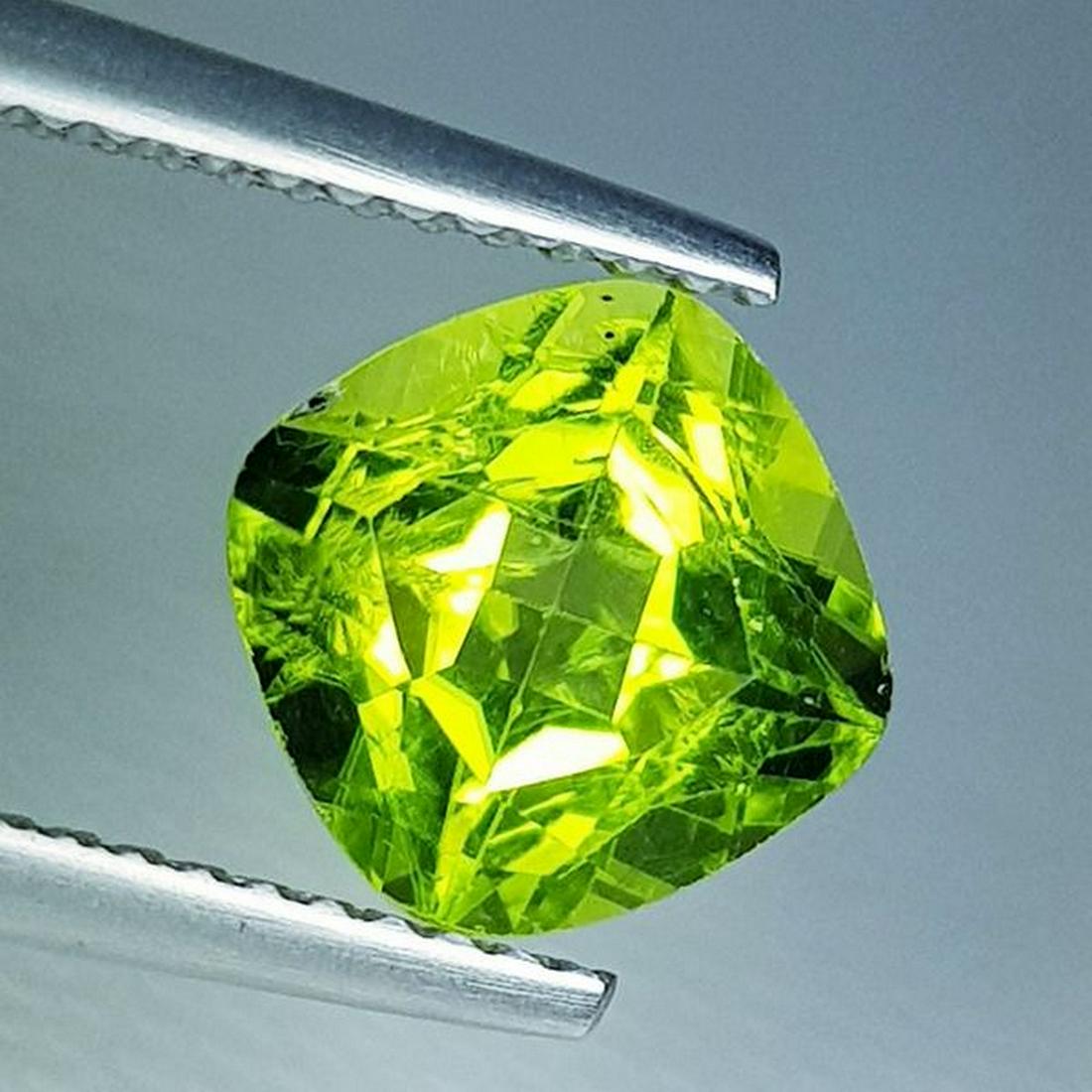 2.59 ct Natural Peridot Cushion Cut: No Reserve! Title: 2.59 ct Natural Peridot Cushion Cut Color/Clarity: VVS Carat Weight: 2.59 Size/Dimensions: 8.00 x 8.00 x 5.50 Additional Information: Cushion - Pakistan Shipping: Domestic: Flat-ra