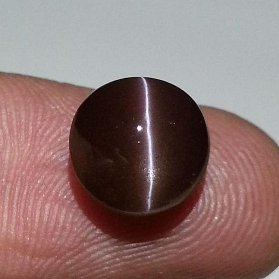 4.37 ct Natural Scapolite Cat' Eye: No Reserve! Title: 4.37 ct Natural Scapolite Cat' Eye Color/Clarity: Opaque Carat Weight: 4.37 Size/Dimensions: 9.50 x 9.50 x 6.50 Additional Information: Round - Africa Shipping: Domestic: Flat-rate