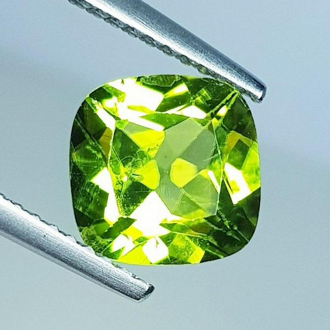Natural Peridot Cushion Cut 2.40 ct: No Reserve! Title: Natural Peridot Cushion Cut 2.40 ct Color/Clarity: VVS Carat Weight: 2.4 Size/Dimensions: 8.00 x 8.00 x 4.90 Additional Information: Cushion - Pakistan Shipping: Domestic: Flat-rat