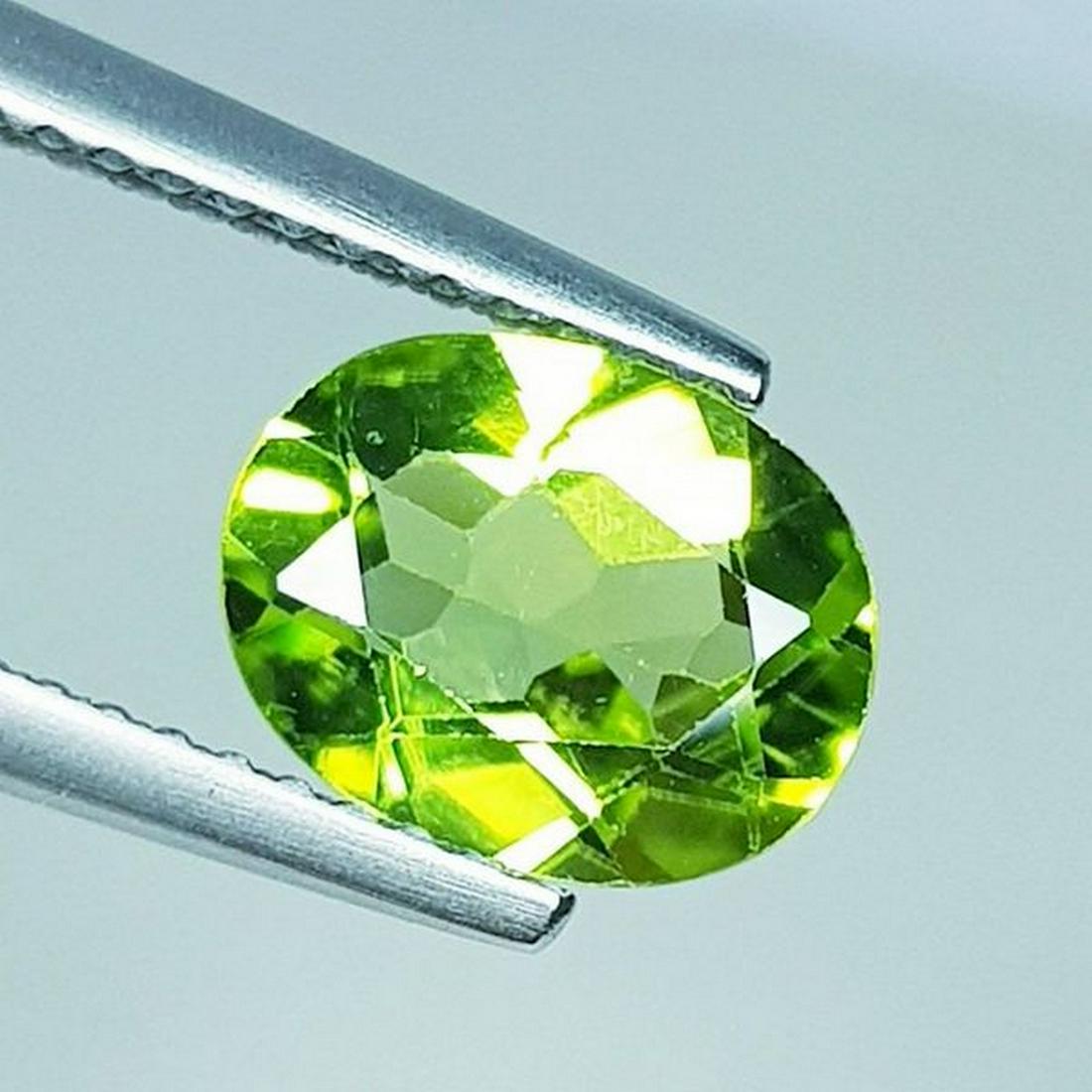 Natural Peridot Oval Cut 1.67 ct: No Reserve! Title: Natural Peridot Oval Cut 1.67 ct Color/Clarity: VVS Carat Weight: 1.67 Size/Dimensions: 9.00 x 7.00 x 3.80 Additional Information: Oval - Pakistan Shipping: Domestic: Flat-rate of