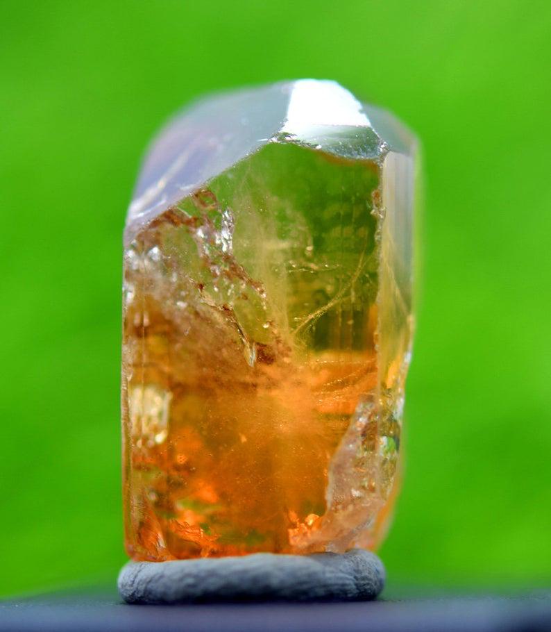 Topaz Crystal ,Double Terminated Damage Free Natural: Materials Topaz, Crystal more Description Topaz Crystal ,Double Terminated Damage Free Natural Topaz From Pakistan - Weight : 21 Gram Size : 32*17*16 mm Treatment : Natural Origin : Pakistan Economy S