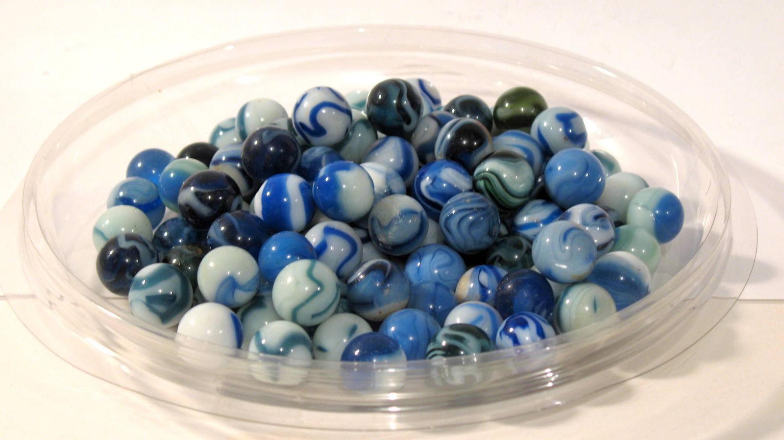 Collection of early blue & white glass marbles. (1 of 1)