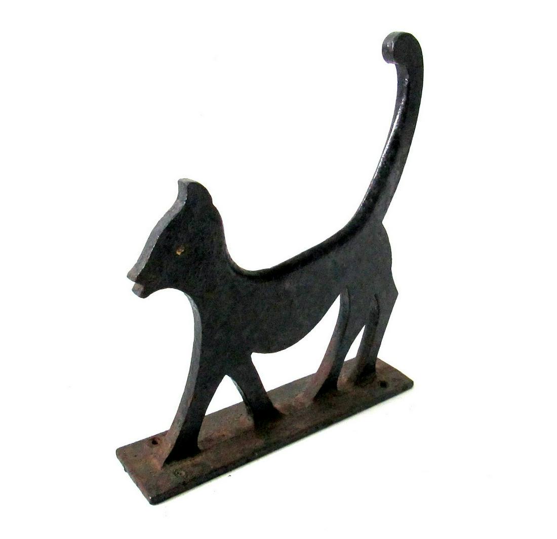 Strutting Cat Boot Scraper: Title: Strutting Cat Boot Scraper Date/Period: C 1900 Material: Cast Iron Dimension: 12 1/8” X 10 3/8”W X 2 1/2”D Provenance: Bold silhouette form, a black cat with “attitude”. Heavy stock c