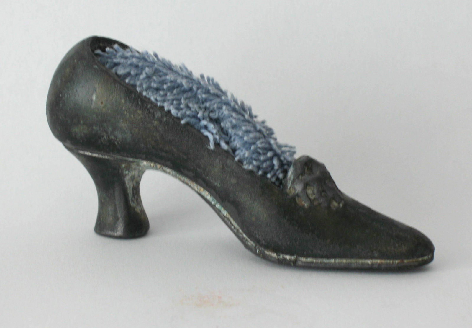 Early small pewter shoe pincushion.: Title: Early small pewter shoe pincushion. Description: Nice early small size pewter shoe pincushion. Dimensions: 3 1/2” long Circa: 1900's Shipping: Domestic: Flat-rate of $15.00 to anywhere within