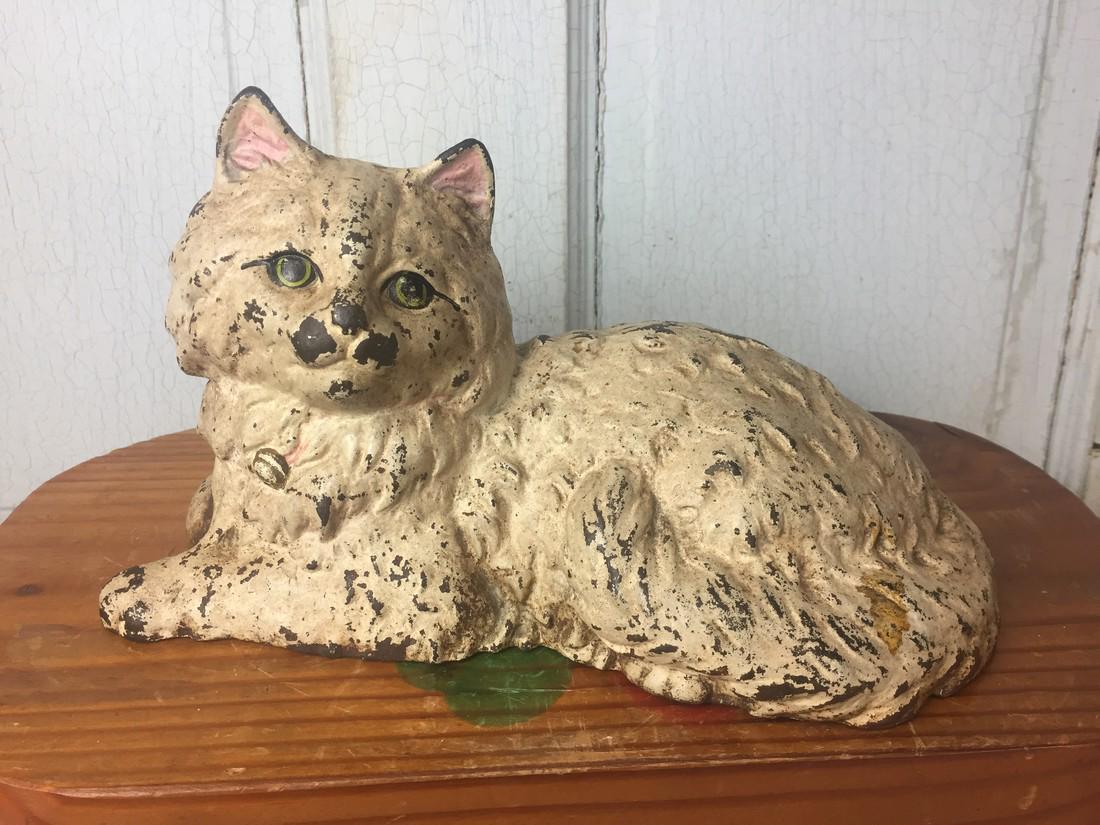 Antique Hubley Hand Painted Cast Iron Reclining Persian: Title: Antique Hubley Hand Painted Cast Iron Reclining Persian Cat Door Stop Date/Period: Approx 1930-1940 Materials: Cast iron Dimension: 6" x 10 1/2" Provenance: Excellent example of this cast iron