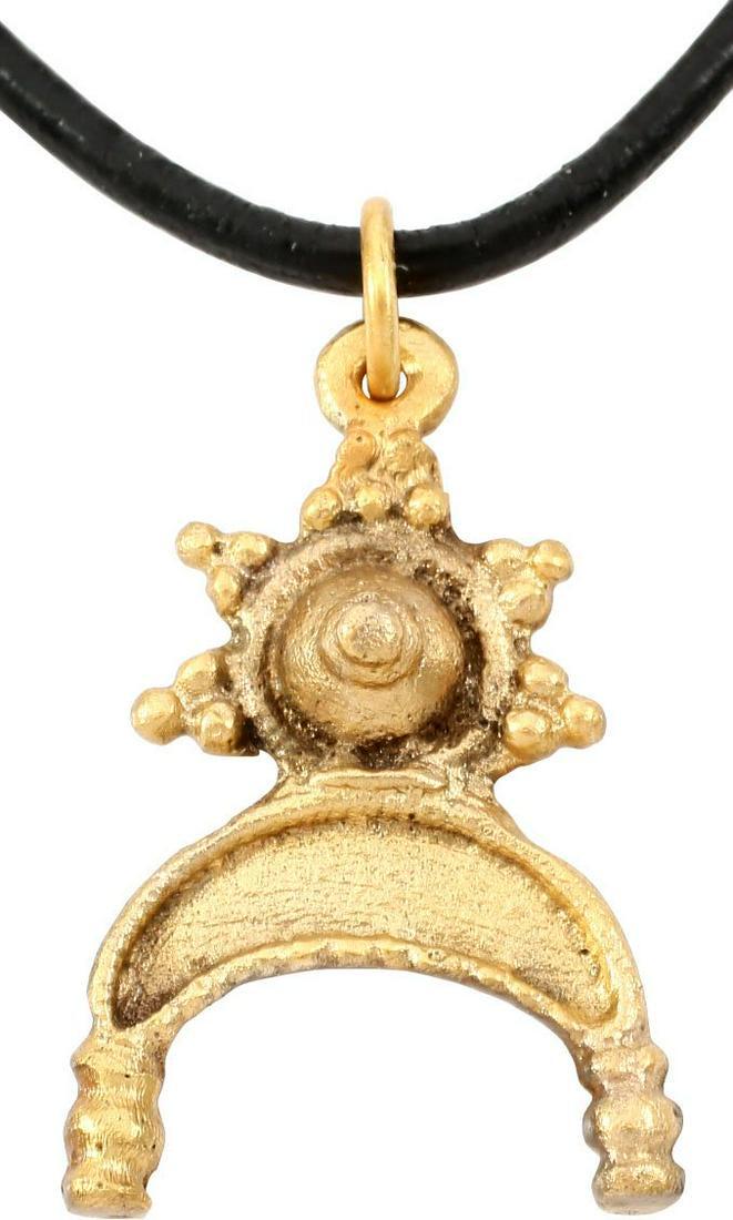 SUPERB VIKING LUNAR PENDANT NECKLACE 9TH-10TH CENTURY: Over 1 1/8” height. Bronze, cast and chased in minute detail as the crescent moon with baluster tips representing Sol the sun and Mani the moon, below a stepped cone surrounded by five triangles of 