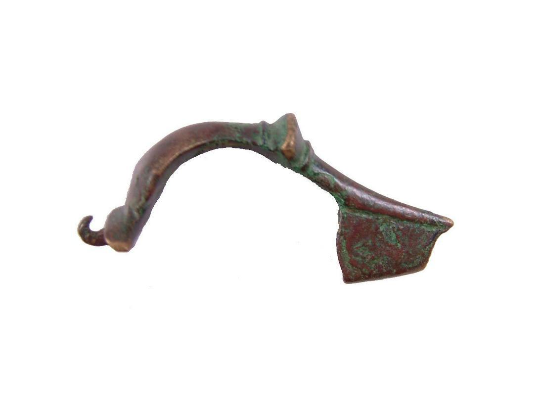 ANCIENT GREEK BROOCH (GARMENT PIN) FIBULA 3-1 CENT BC: No Reserve! The original garment pin patented two millennia later as the “safety pin”. Arch form with medieval ring. The pin seat intact. These served as a fashion accessory as well as a garment f