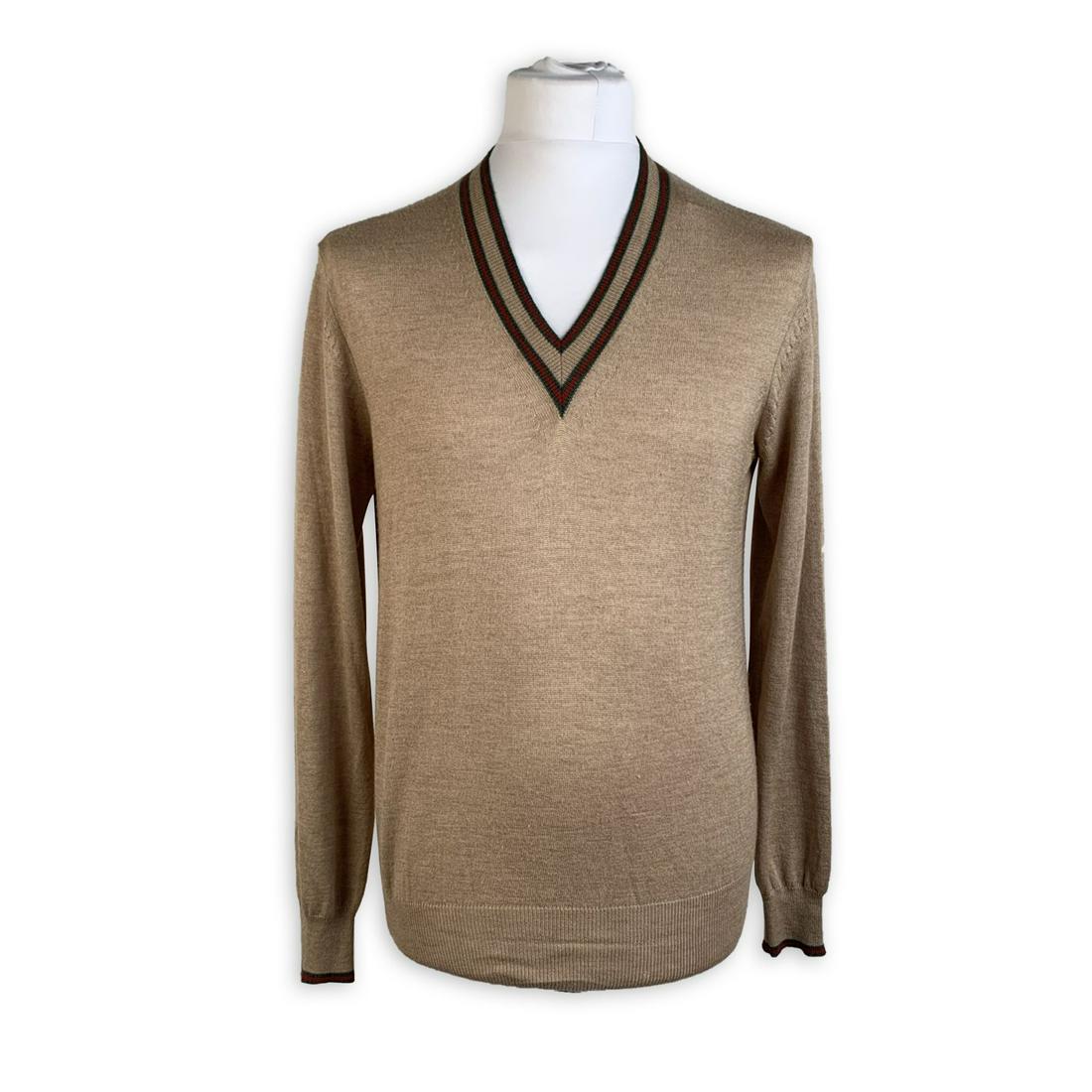 Gucci Beige Camel Hair and Silk Men V Neck Sweater Size: Gucci beige v-neck sweater for Men. It features green/red/green stripes along the neckline and along the cuffs. Composition: 50% Camel hair 50% Silk. Made in Italy. Size: MEDIUM (The size shown for th