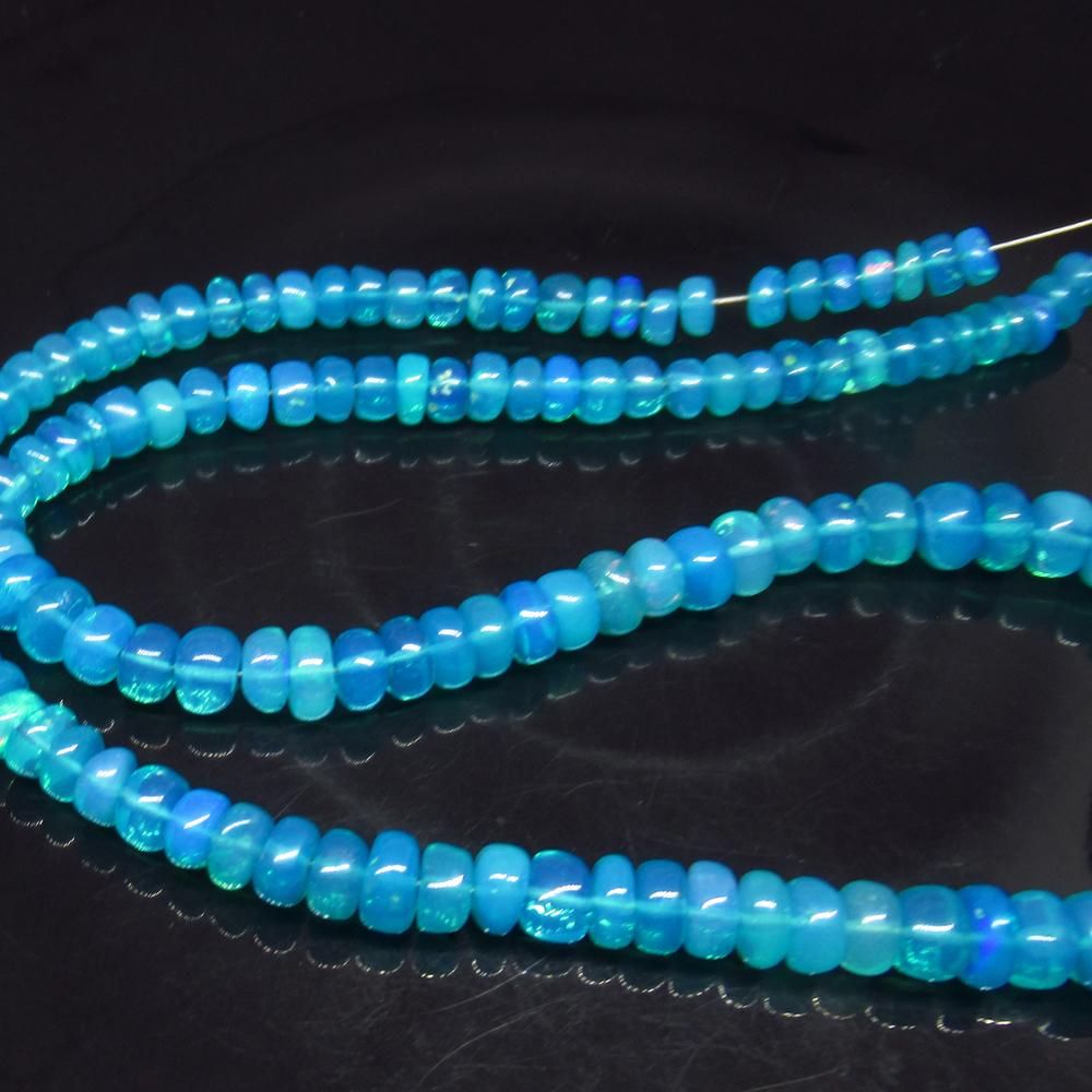 56.65 Ct Natural 145 Ethiopian Drilled Neon Blue Fire (1 of 3)