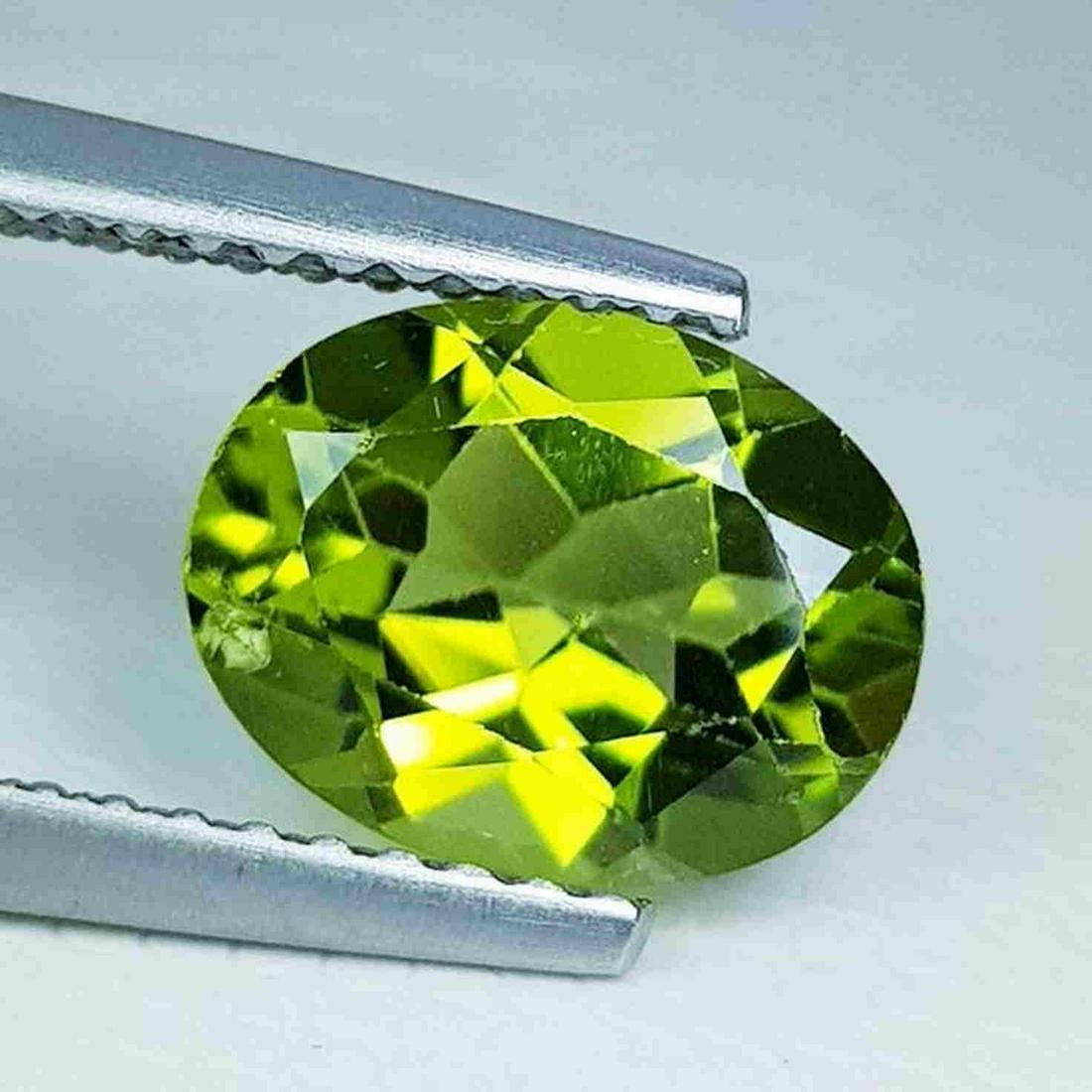 Natural Peridot Oval Cut 1.82 ct: Title: Natural Peridot Oval Cut 1.82 ct Gemstone: Peridot Color/Clarity: IF - VVS Carat Weight: 1.82 Size/Dimensions: 9.00 x 7.00 x 4.20 Additional Information: Oval - Pakistan Reserve: $10.00 Shippi