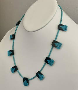 Tab Necklace - Janie and Rose Reano: Title: Tab NecklaceArtist's Name: Janie and Rose ReanoDate/Period: 2019Materials: Sterling Silver Black Jet, Kingman TurquoiseDimensions: 18"Native American Tribe: Description: Black Jet and Kingman