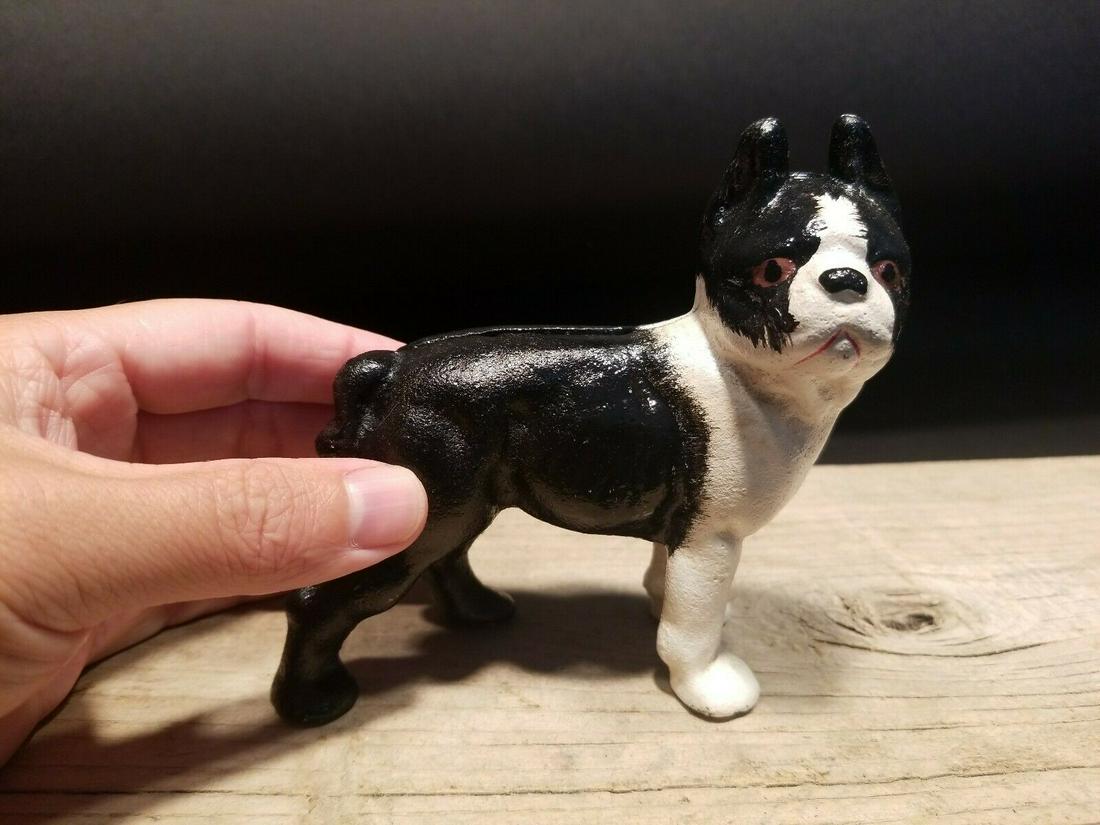 Miniature Cast Iron Boston Terrier Coin Bank Dog Statue: 5" Long x 4 3/4" tall 1 lb 10 oz Great little reproduction cast iron dog. All cast iron, hand painted, slightly distressed as shown in the images. Certainly looks old! Reserve: $25.00 Shipping: Domest