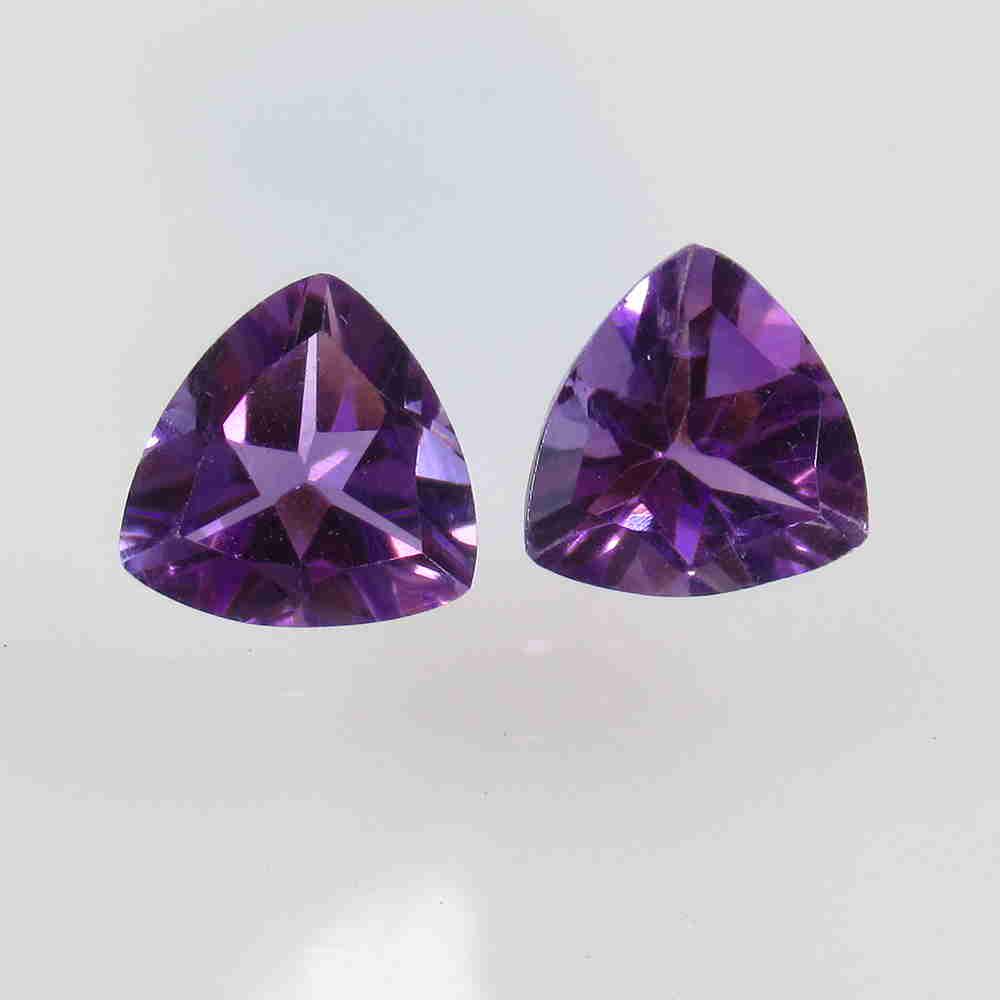 4.08 Ctw Natural Purple Amethyst Trillion Pair: No Reserve! Title: 4.08 Ctw Natural Purple Amethyst Trillion Pair Stone Clarity: VVS Gemstone: Amethyst Carat Weight: 4.08 Size/Dimensions: 9.10 x 9.10 x 5.50 mm / 2 PC's Additional Information: Top C