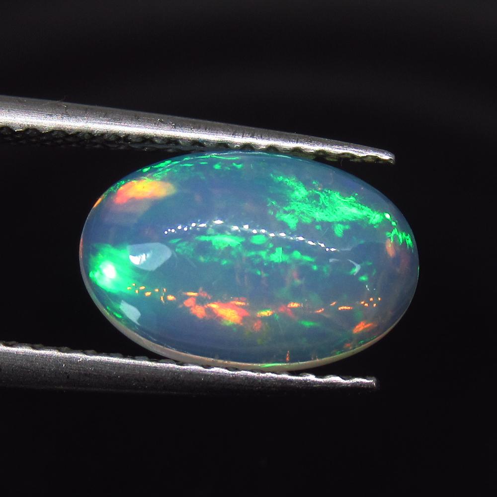 1.75 Ct Natural Ethiopian Multi-Color Welo Opal Oval: No Reserve! Title: 1.75 Ct Natural Ethiopian Multi-Color Welo Opal Oval Cab Stone Clarity: Transparent Gemstone: Natural Opal Carat Weight: 1.75 Size/Dimensions: 11.80 x 7.70 x 4.70 mm Additional Info