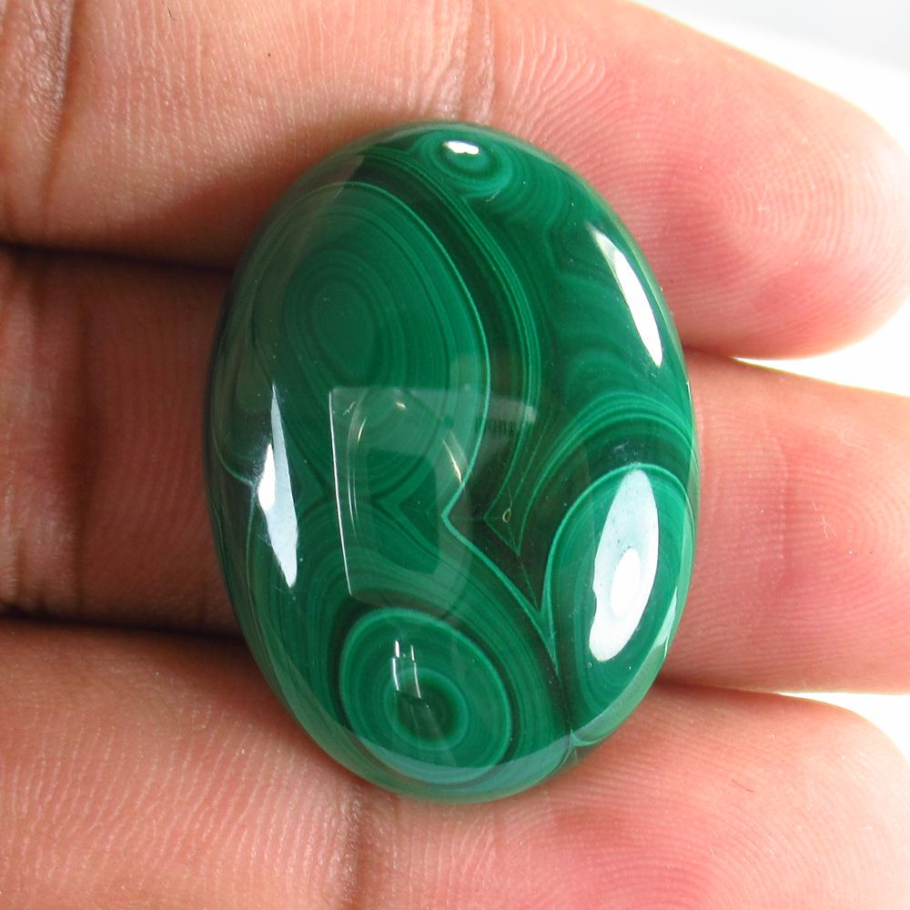 58.26 Ct Natural Green Malachite 31x23mm Oval Cab: No Reserve! Title: 58.26 Ct Natural Green Malachite 31x23mm Oval Cab Stone Clarity: Opaque Gemstone: Natural Malachite Carat Weight: 58.26 Size/Dimensions: 31.00 x 23.00 x 7.10 mm Additional Informati