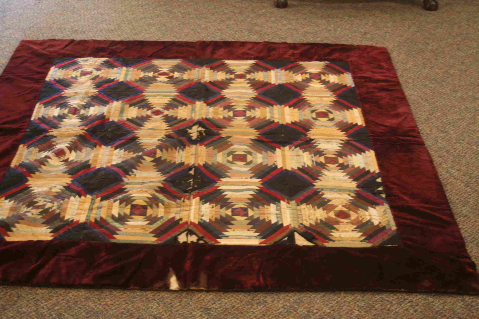 A silk and velvet log cabin quilt in the windmill (1 of 3)