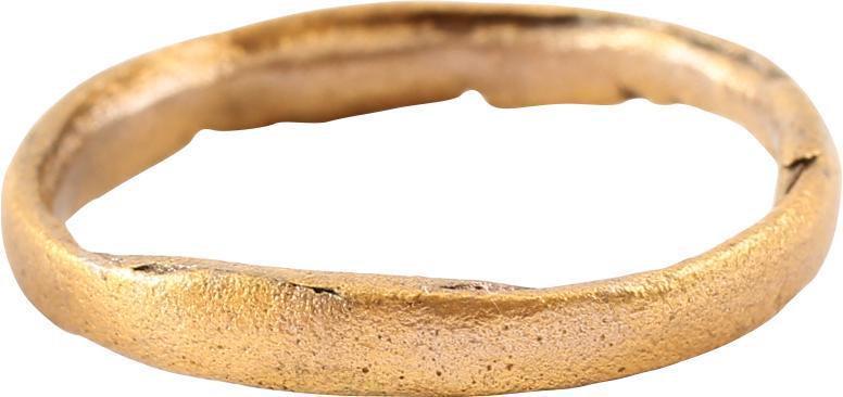 ANCIENT VIKING MAN’S WEDDING RING C.850-950 AD SIZE 8 ¼: 3.0mm width round-faced band. Size 8 1/4. Gilt bronze, evidently cast as a disk with the center removed by hand. It is thought that Viking warriors wore narrow rings to minimize interference with the